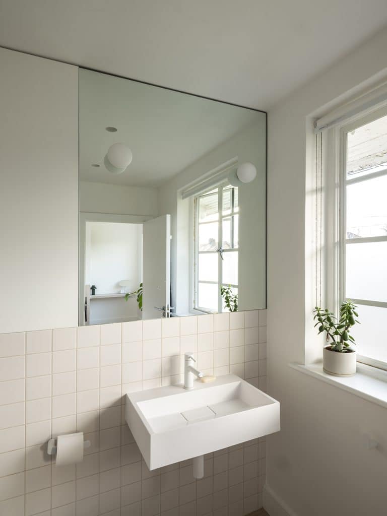 a sink a mirror and a window
