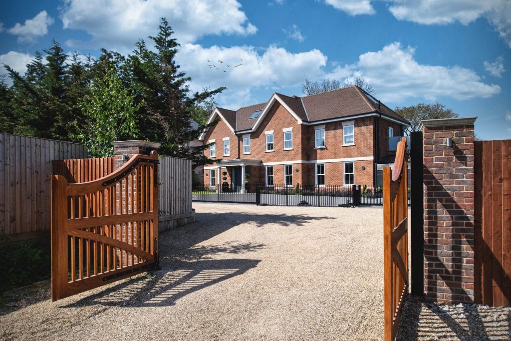 a house with a wooden fence