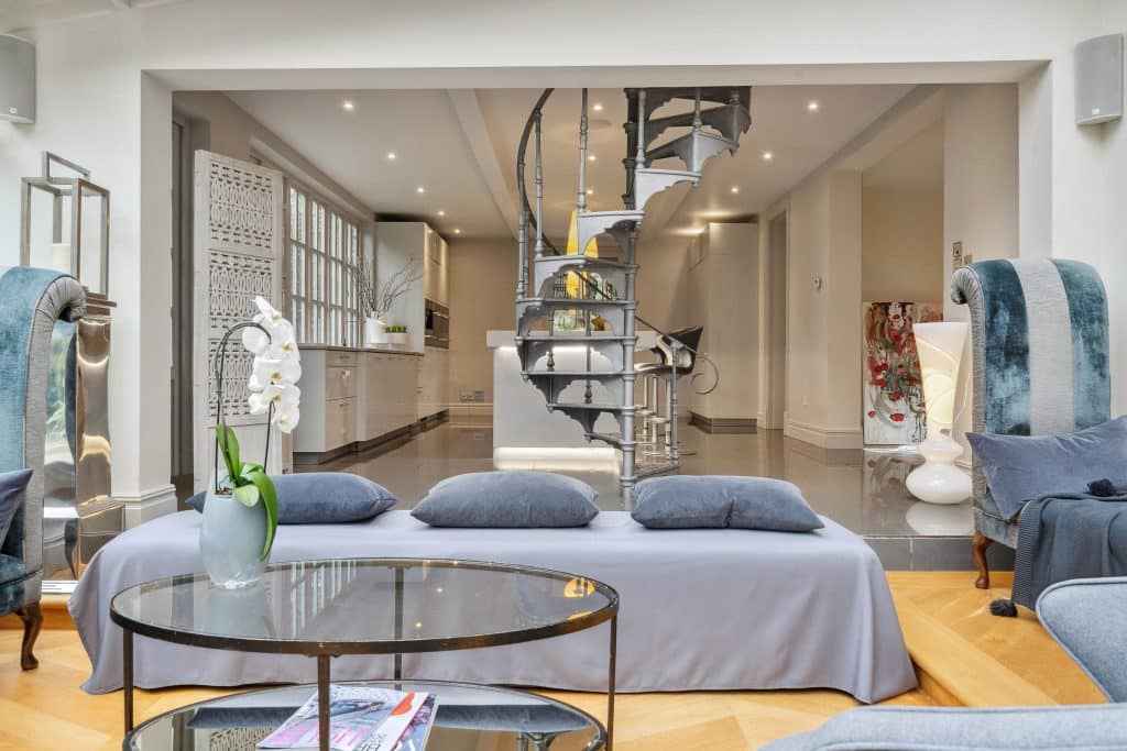a living room filled with furniture and a table