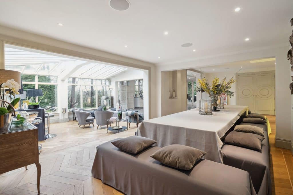 a living room filled with furniture and a large window