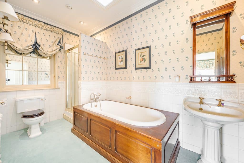 a room with a sink and a mirror