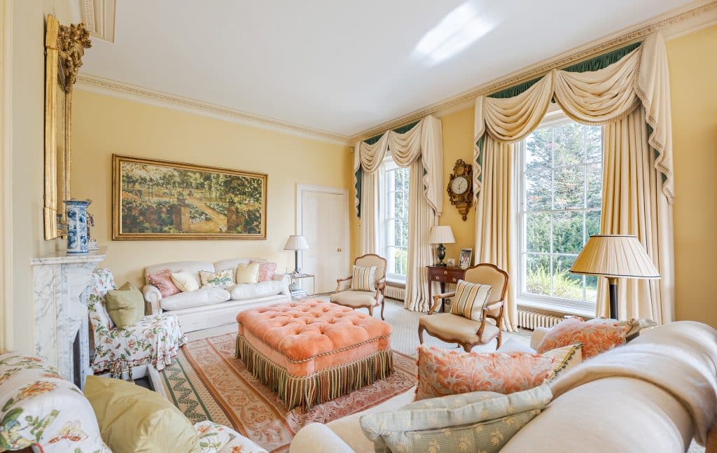 a living room filled with furniture and a bed