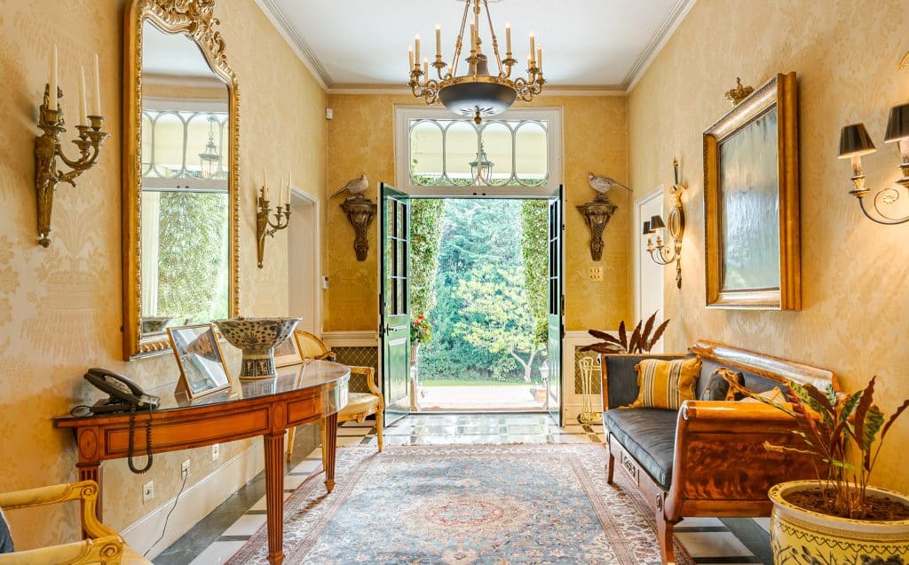 a living room filled with furniture and a fire place
