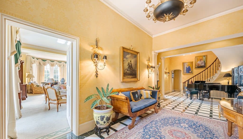 a living room filled with furniture and a fireplace