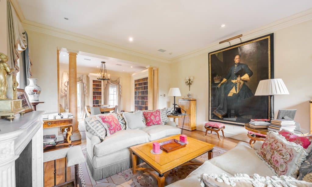 a living room filled with furniture and a flat screen tv