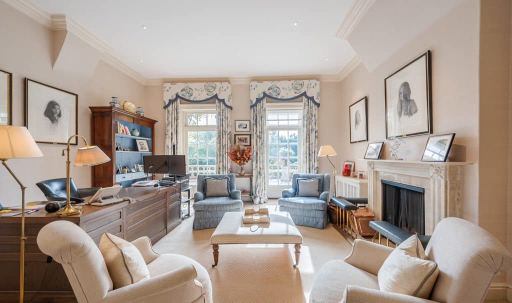 a living room filled with furniture and a fire place