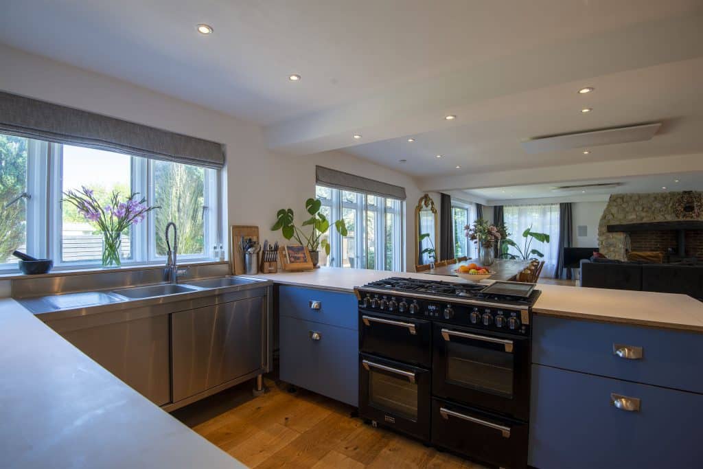 a kitchen with an island in the middle of a room