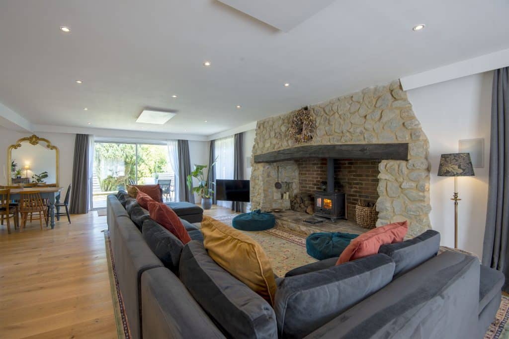 a living room filled with furniture and a large window