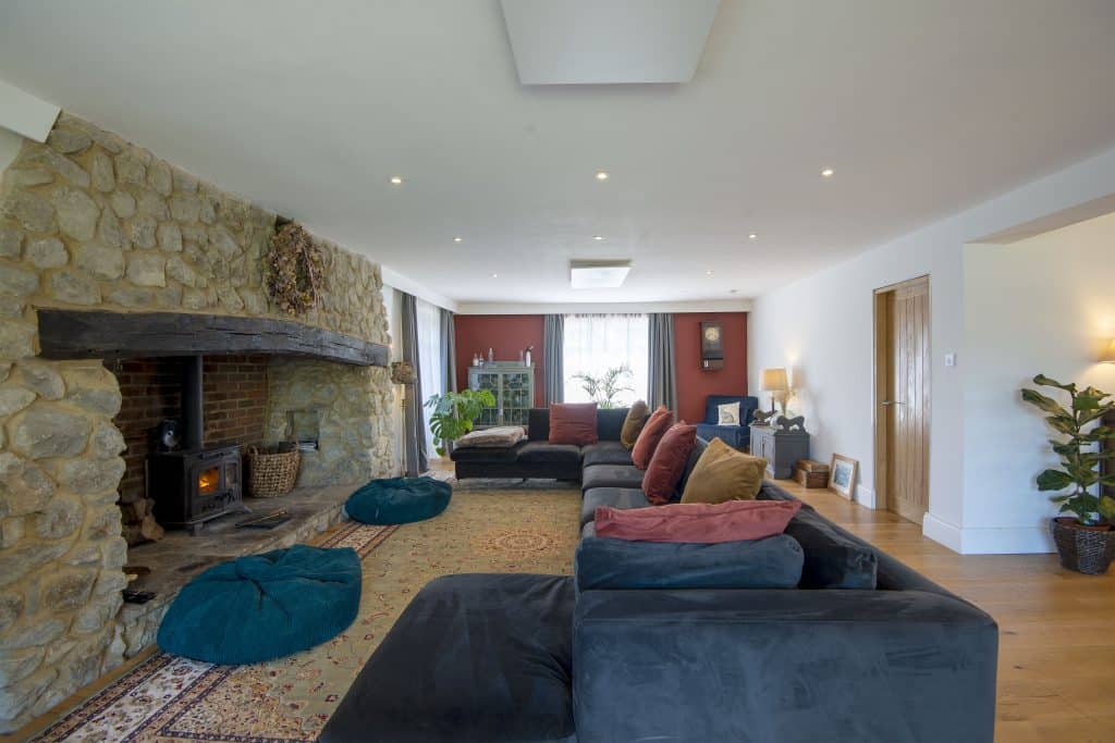 a living room filled with furniture and a fireplace