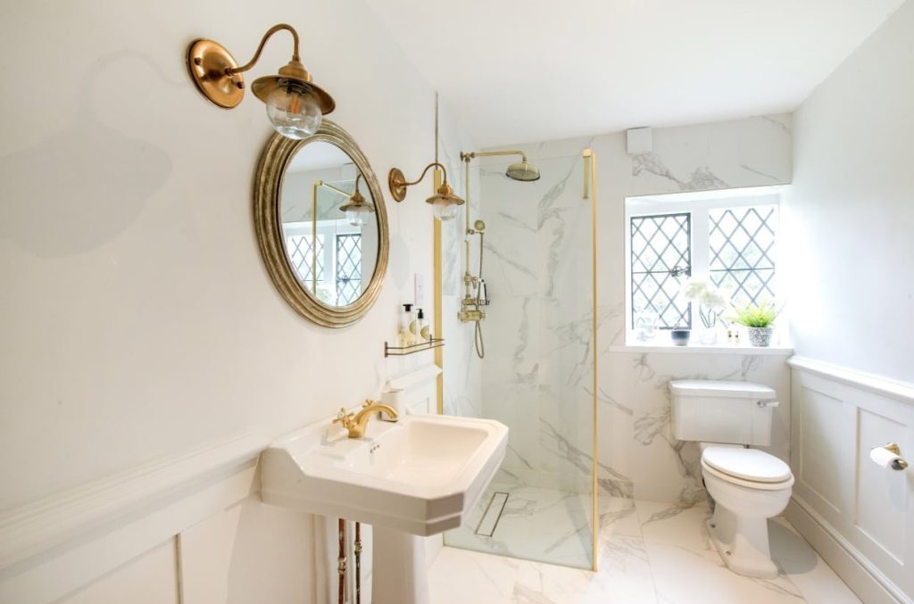 a room with a sink and a mirror
