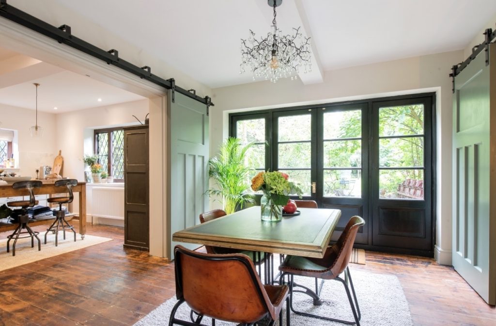 a living room filled with furniture and a large window