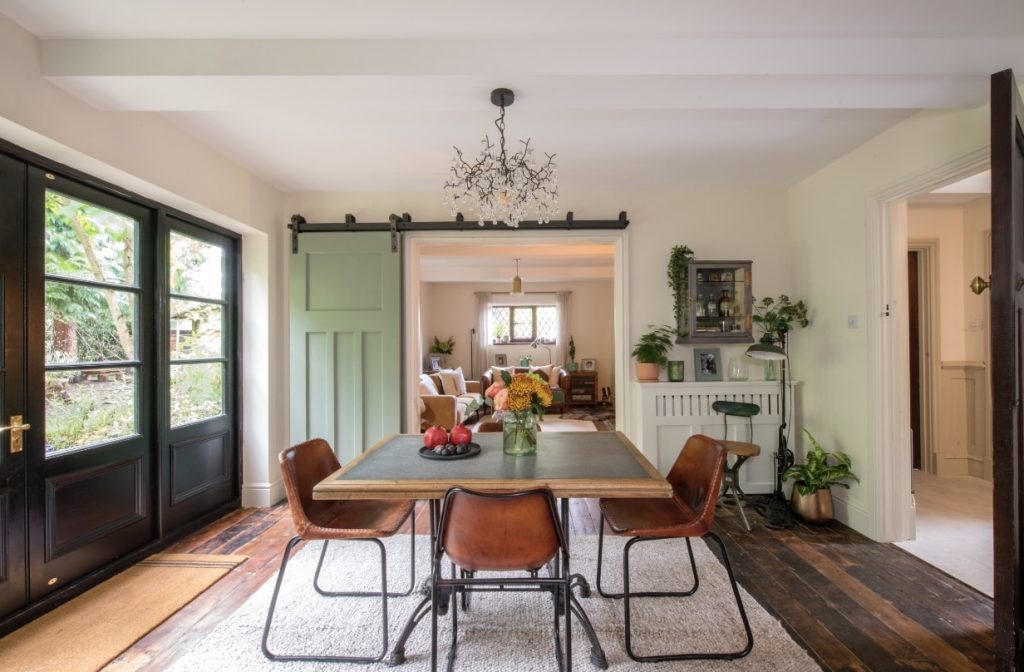 a living room filled with furniture and a large window