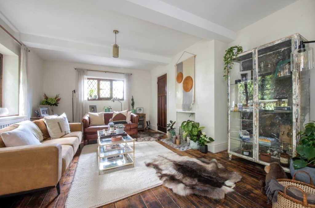 a living room filled with furniture and a fireplace