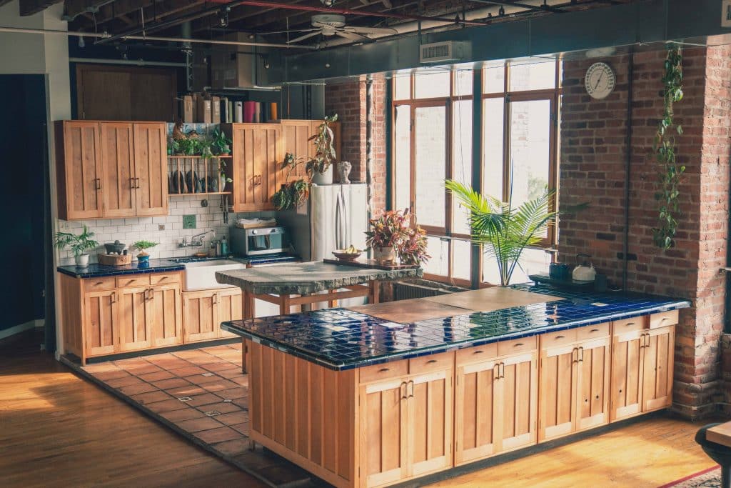 a kitchen area with a building in the background