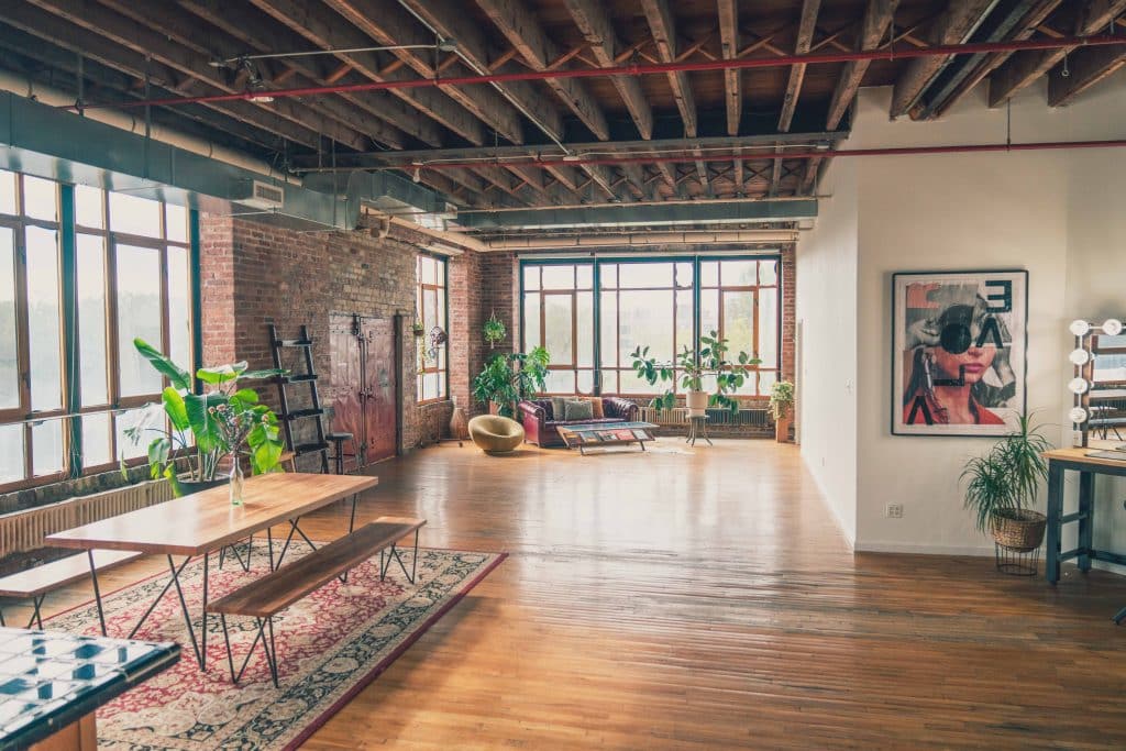 a living room filled with furniture and a large window