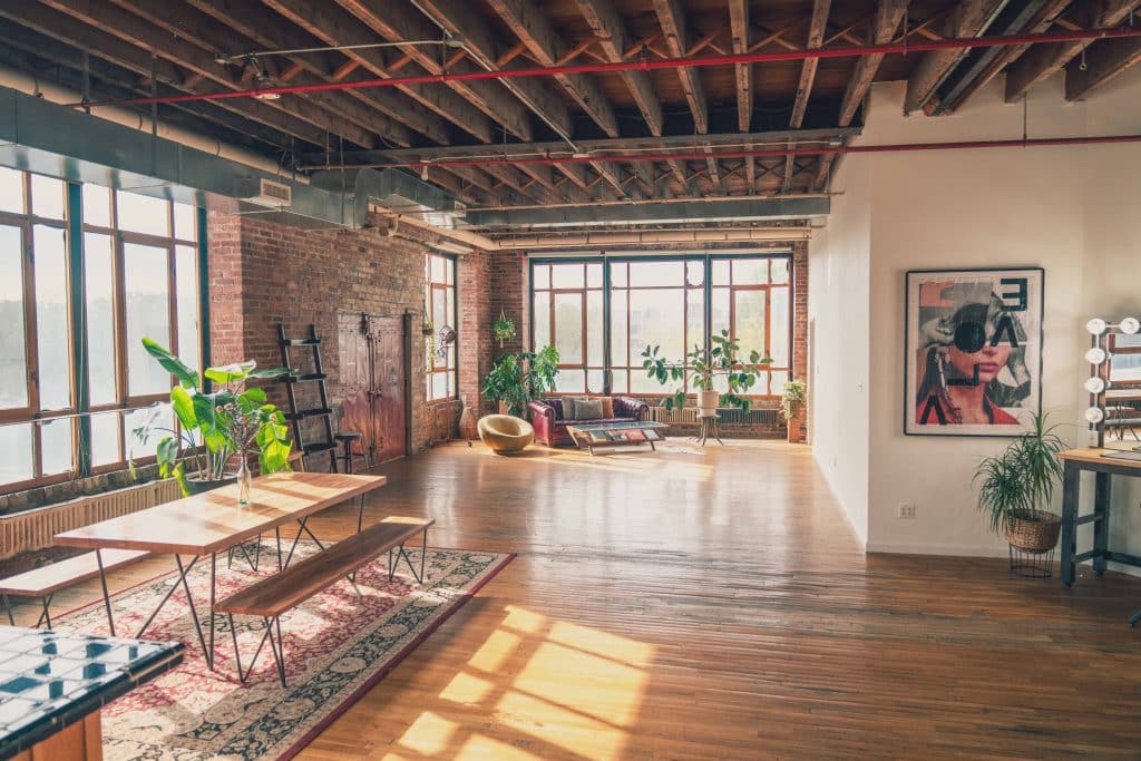 a living room filled with furniture and a large window