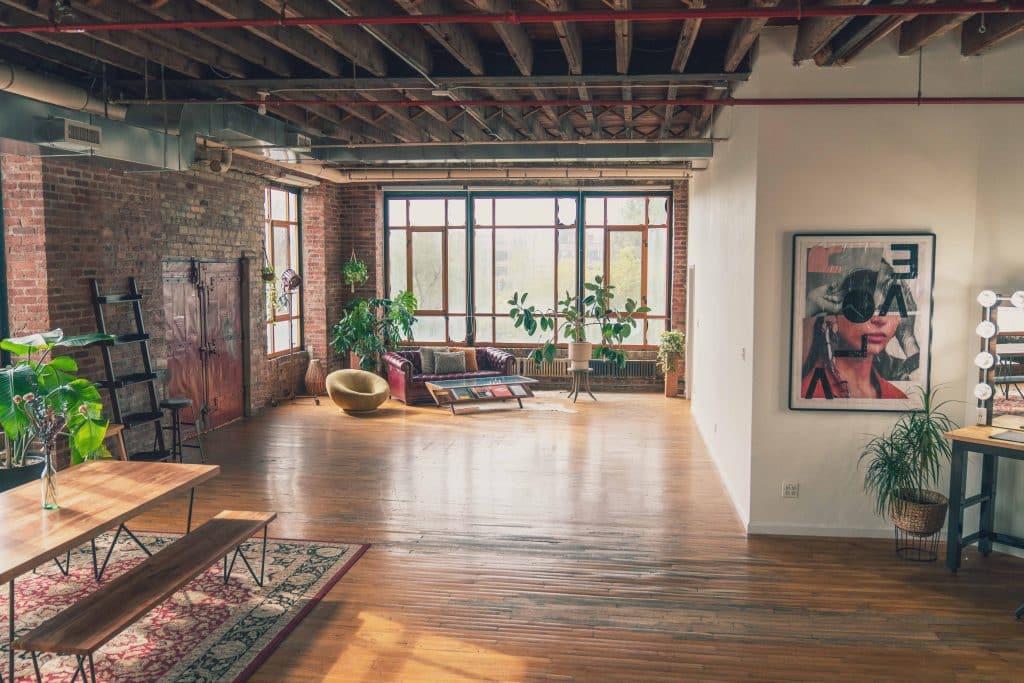 a living room filled with furniture and a large window