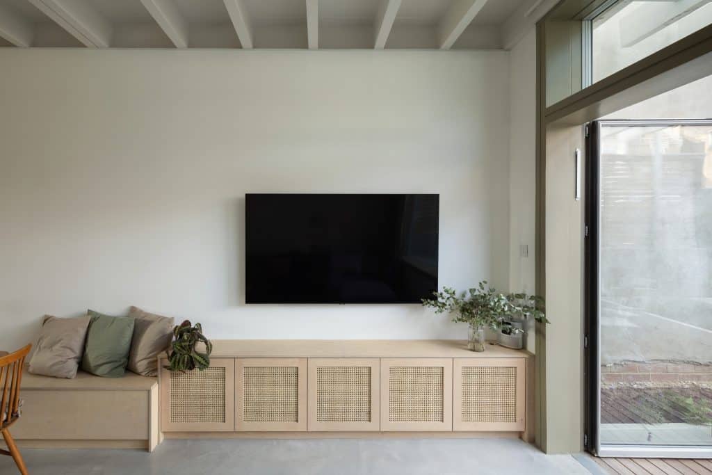 a living room with a fireplace and a large window