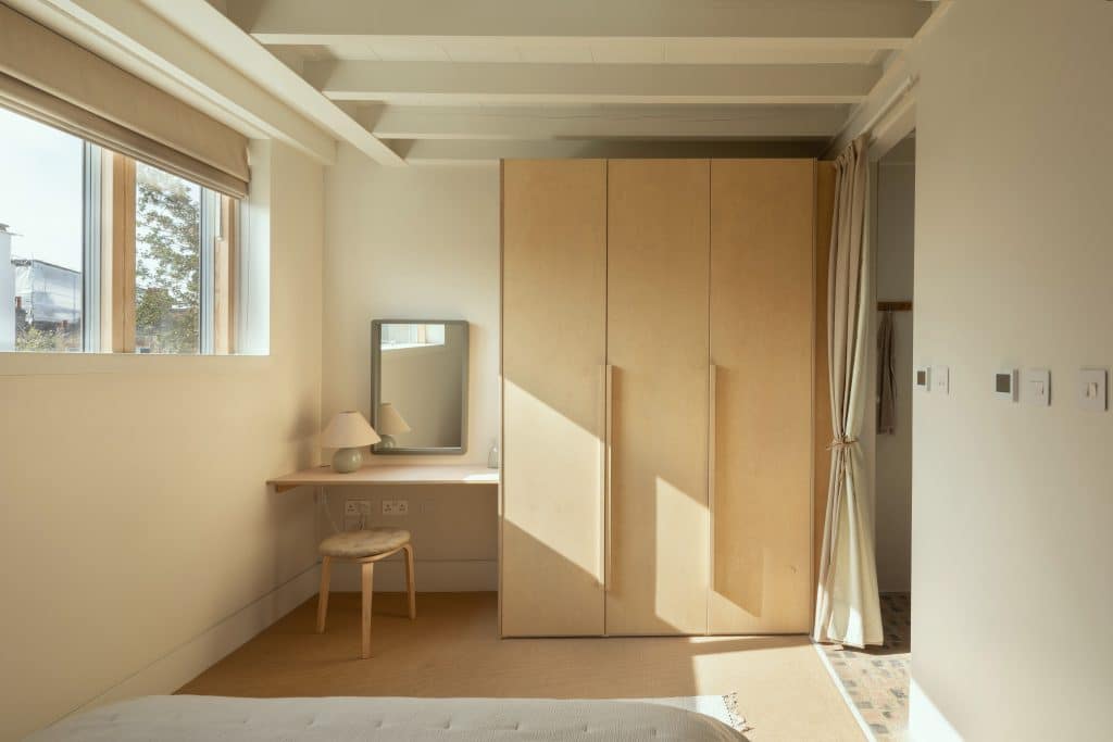 a bedroom with a large window
