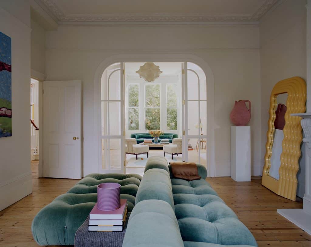 a bedroom with a view of a living room