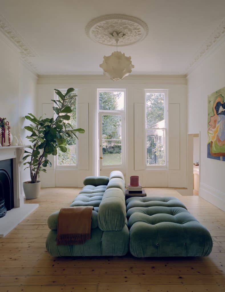a living room filled with furniture and a fire place