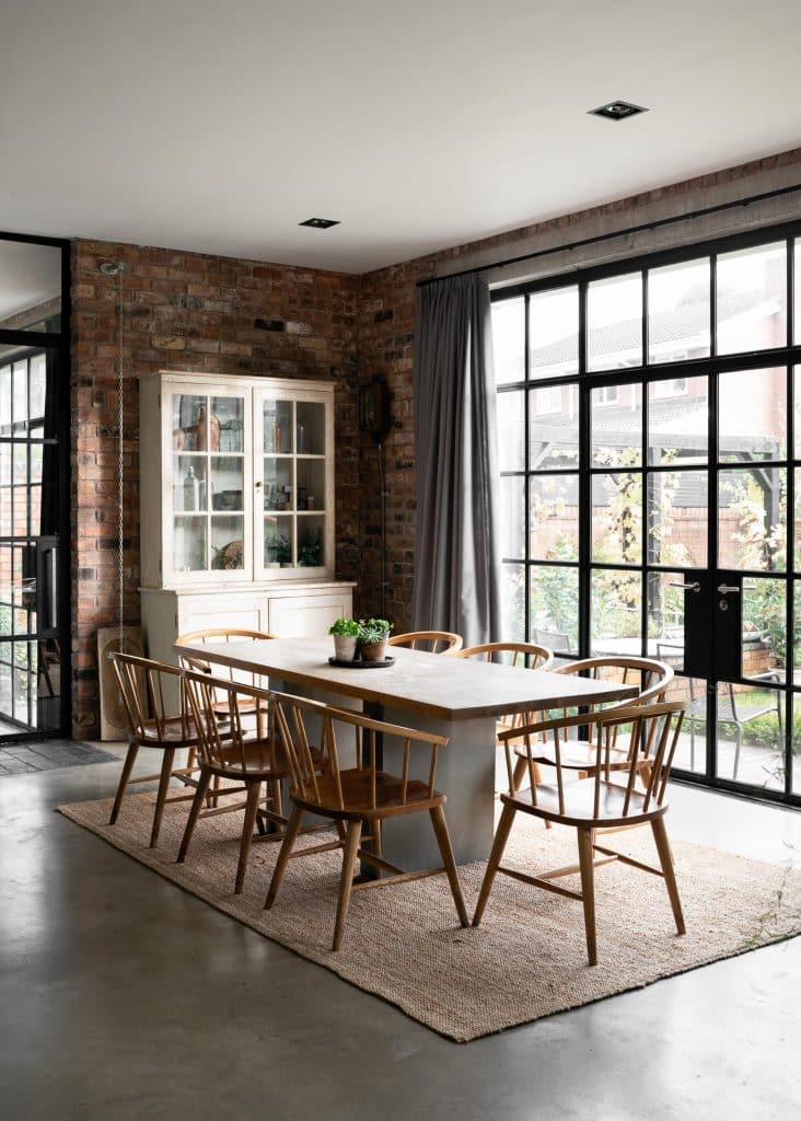 a living room filled with furniture and a large window