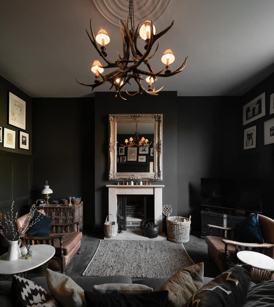 a living room filled with furniture and vase of flowers on a table
