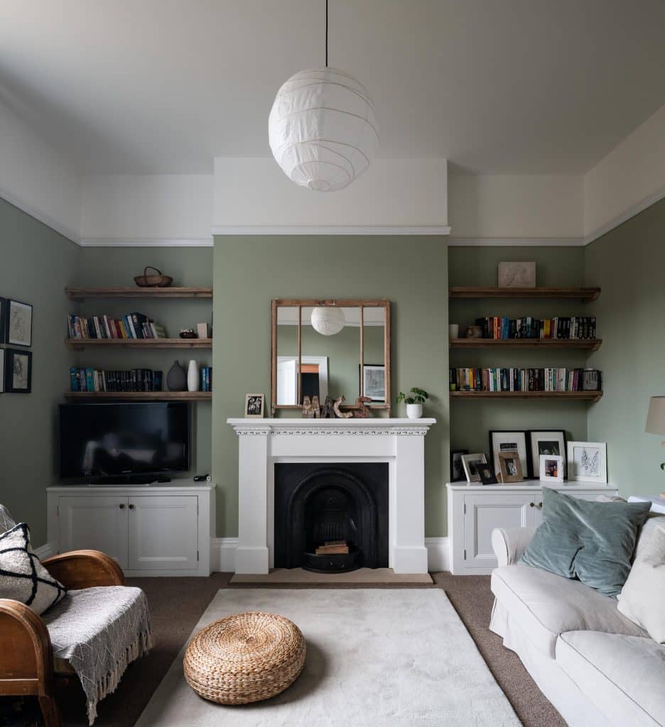 a living room filled with furniture and vase