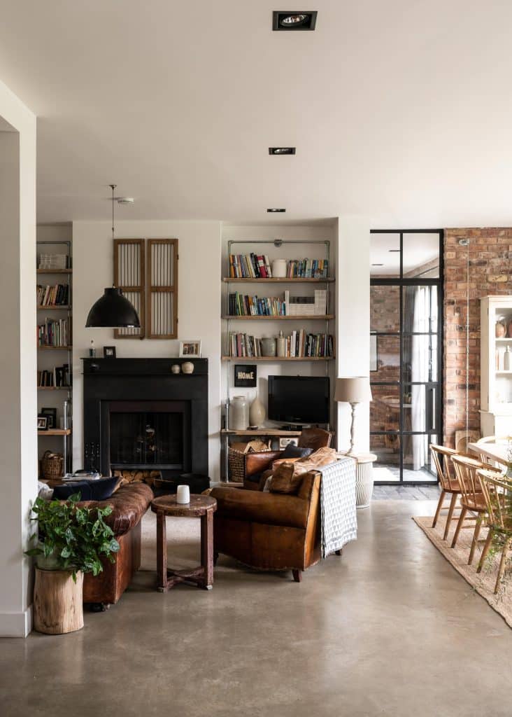 a living room filled with furniture and a fire place