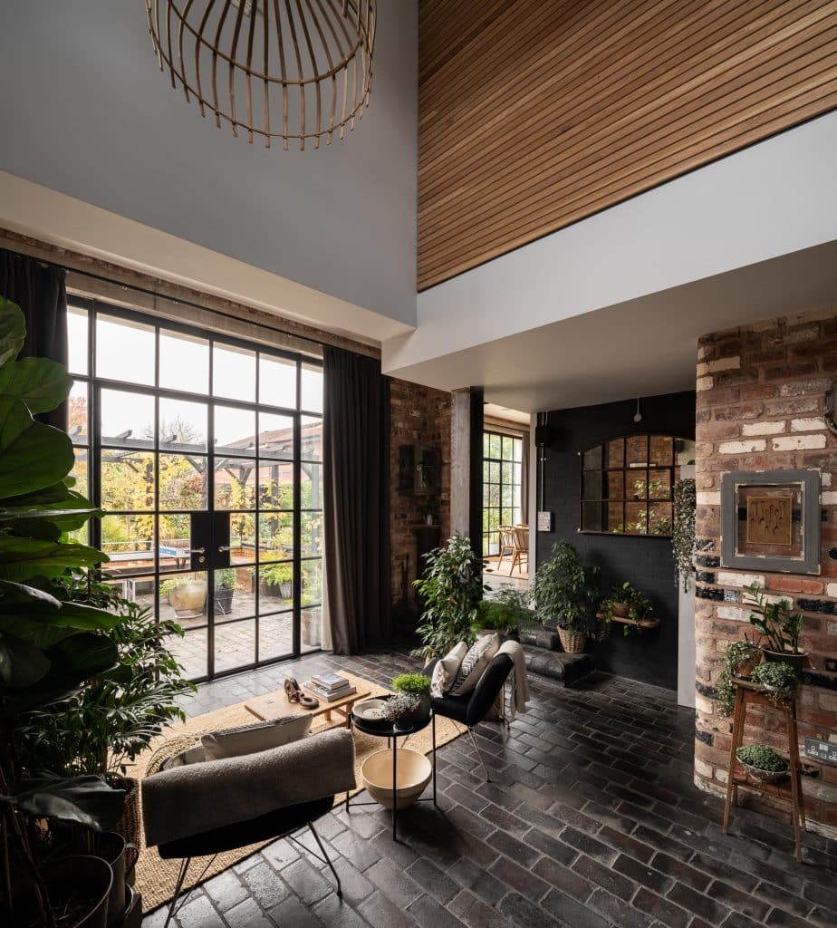 a living room filled with furniture and a large window