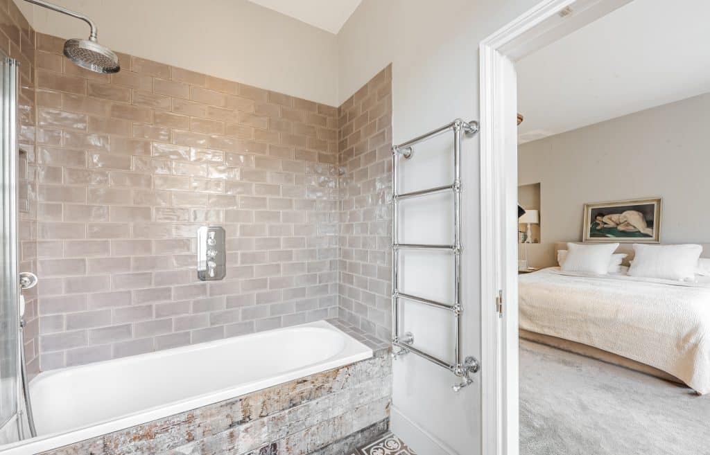 a room with a sink and a mirror