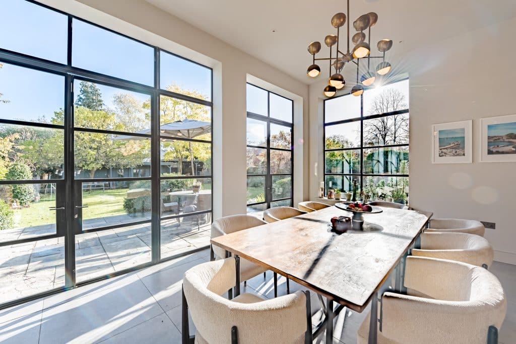 a room filled with furniture and a large window