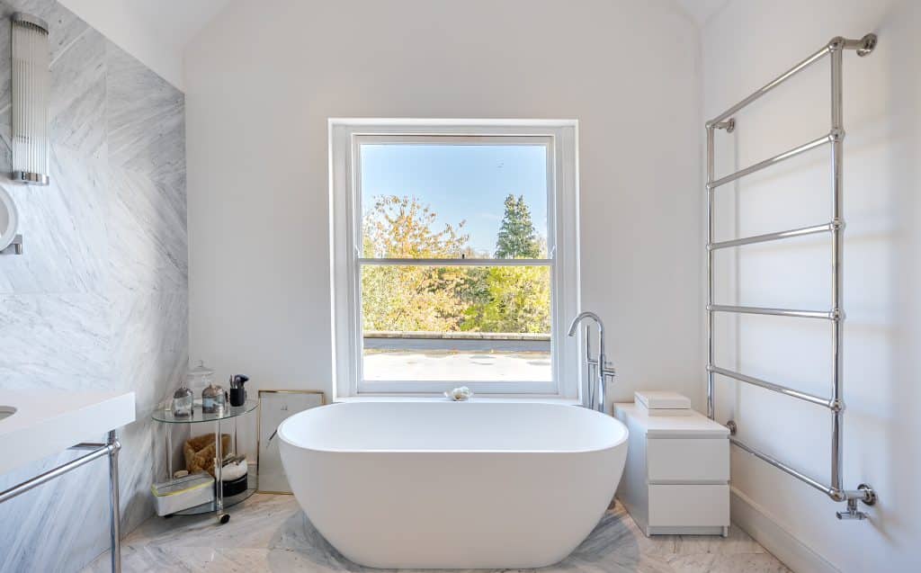 a room with a sink and a mirror