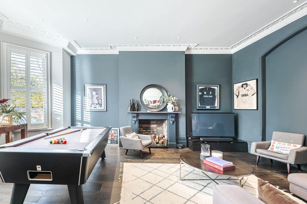 a living room filled with furniture and a large window