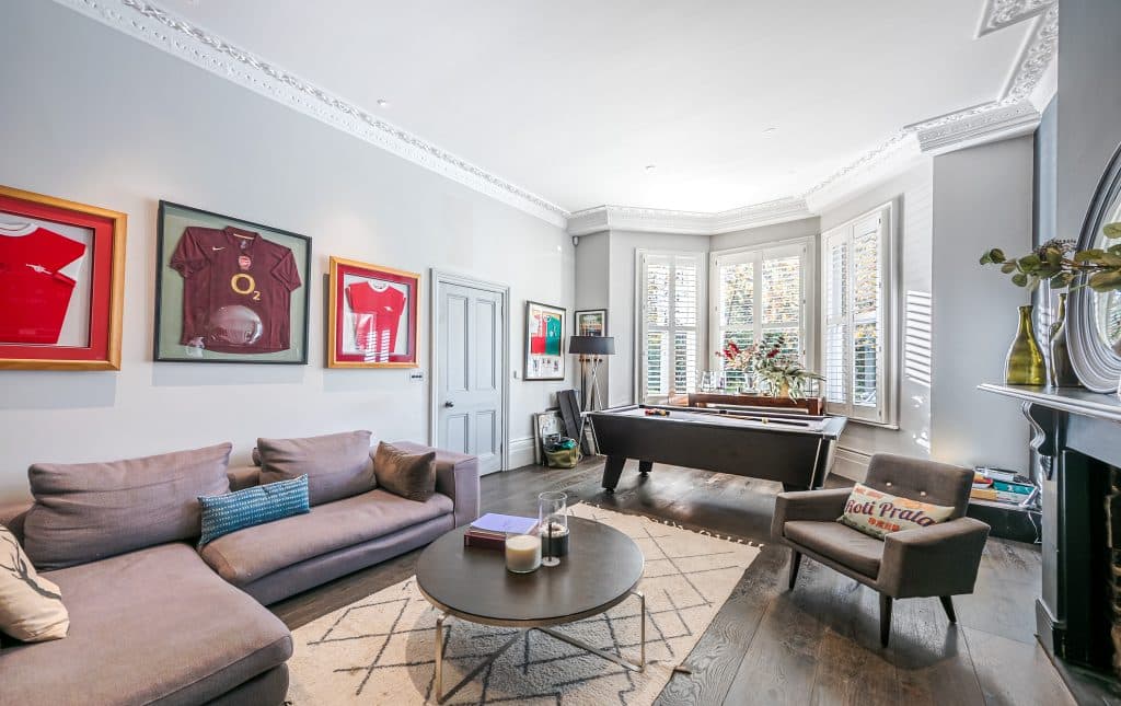 a living room filled with furniture and a large window