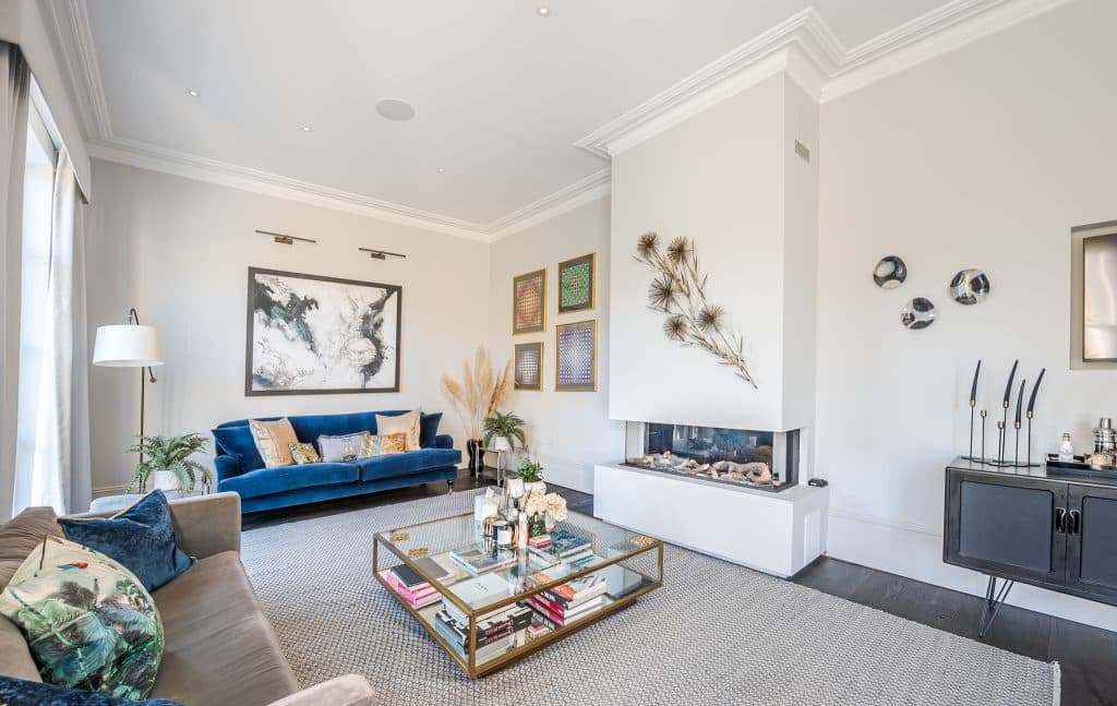 a living room filled with furniture and a fireplace