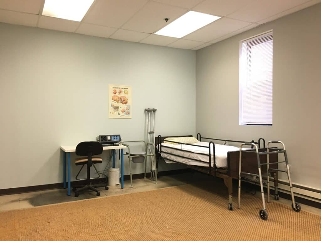 a room filled with furniture and a large window