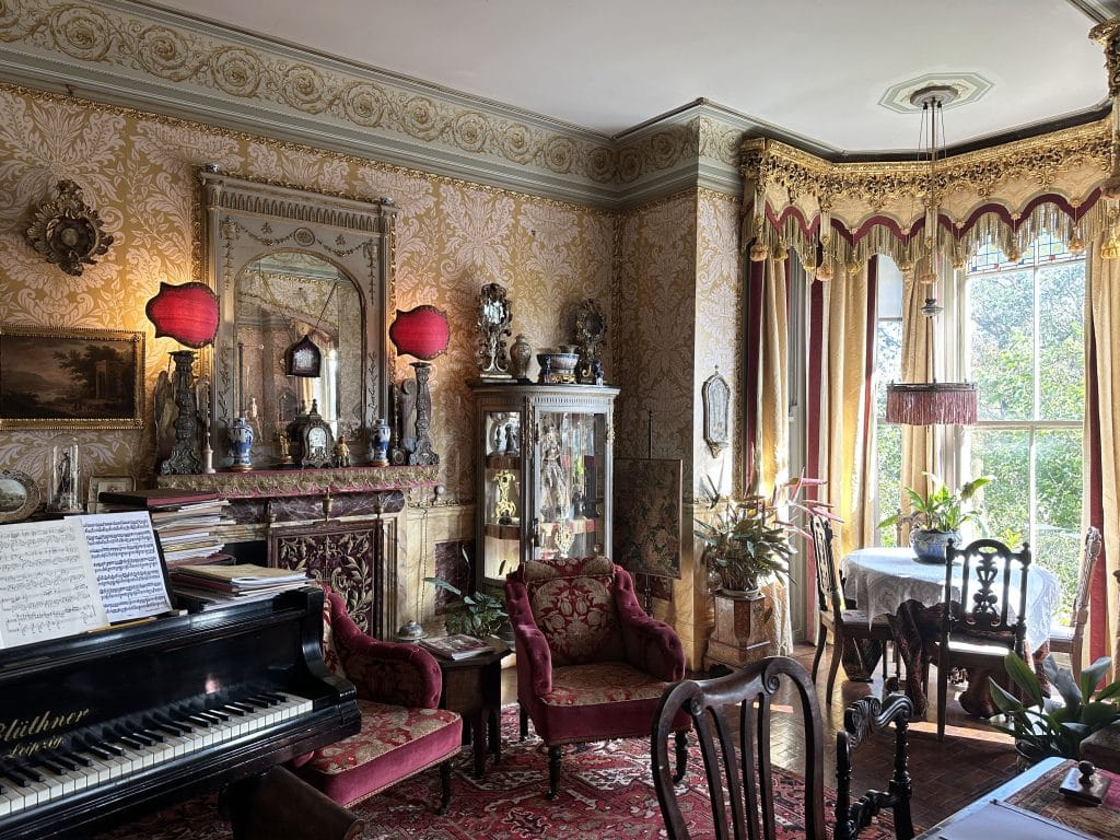 a living room filled with furniture and a large window