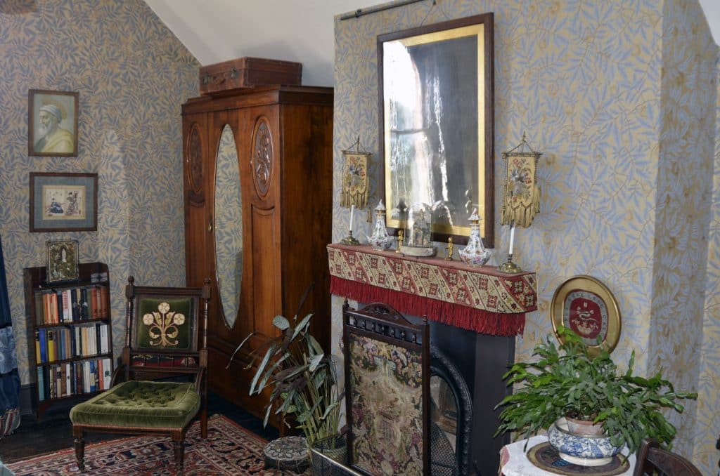 a bedroom with a fireplace