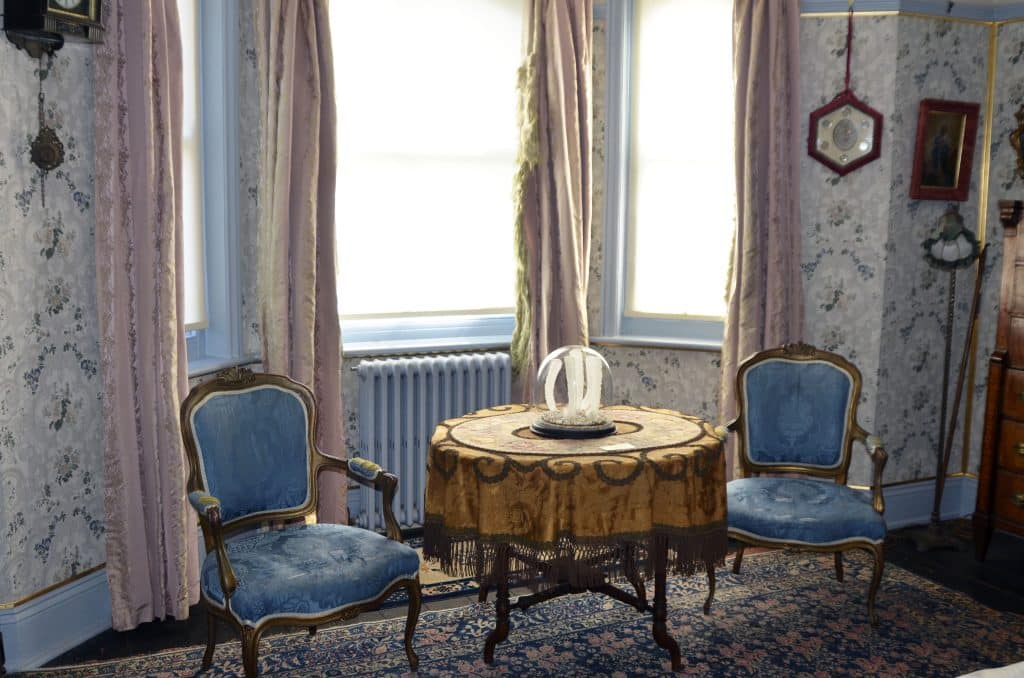 a chair sitting in front of a window