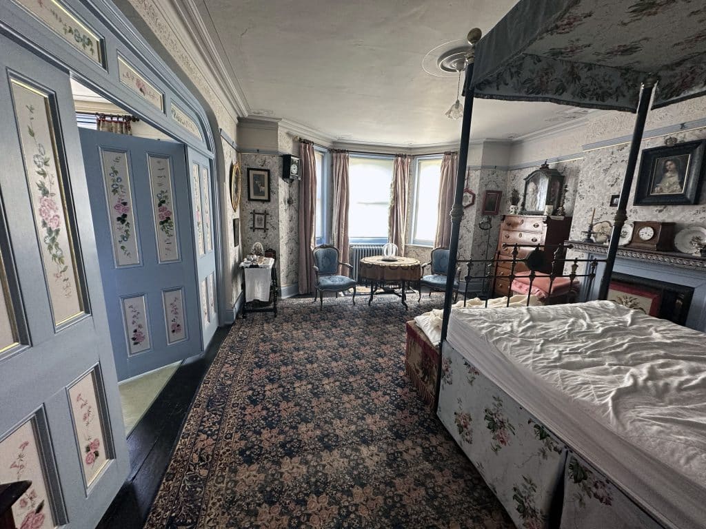 a bedroom with a large window