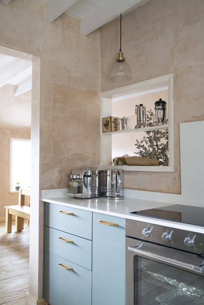 a kitchen with a stove and a sink