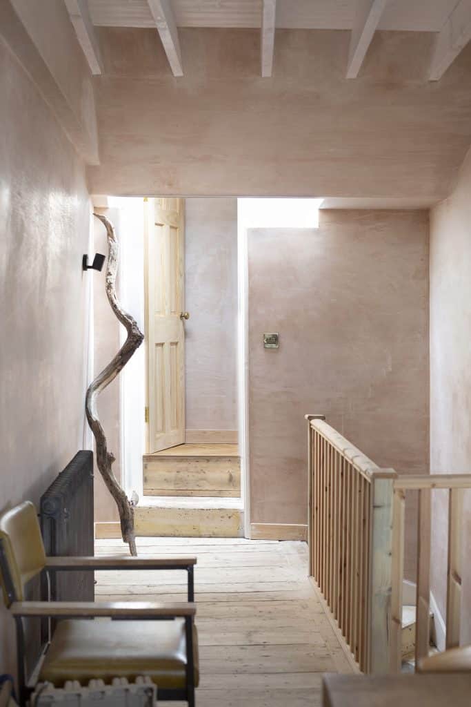 a wooden bench sitting in a room