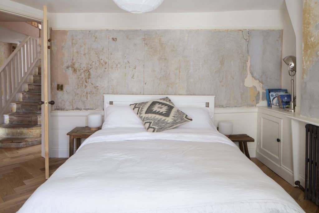 a bedroom with a large bed in a room