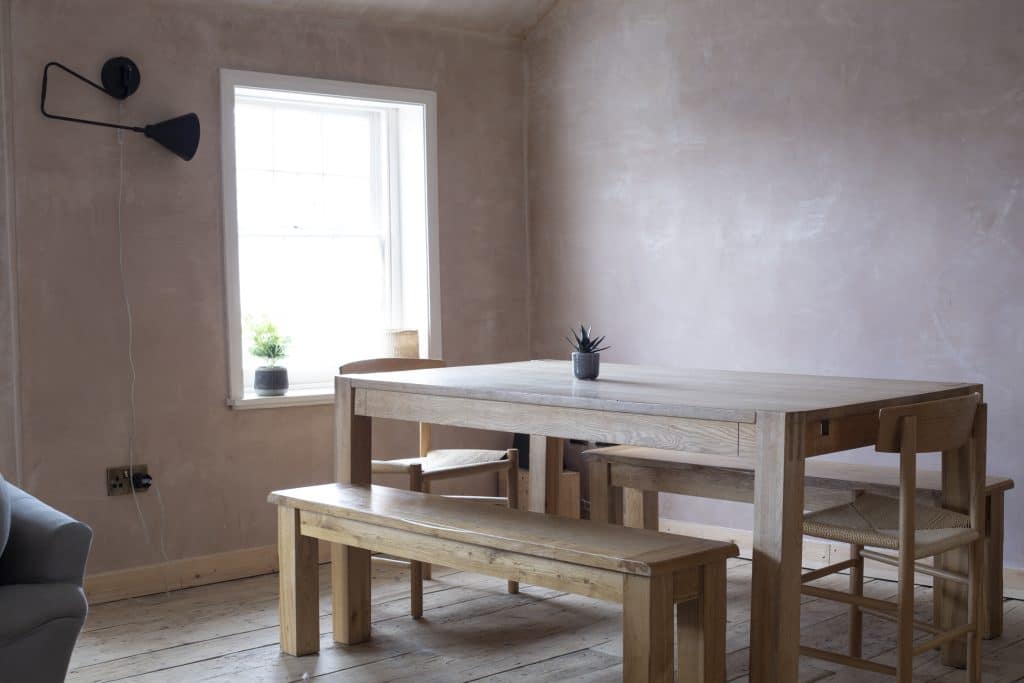 a room with a wooden table