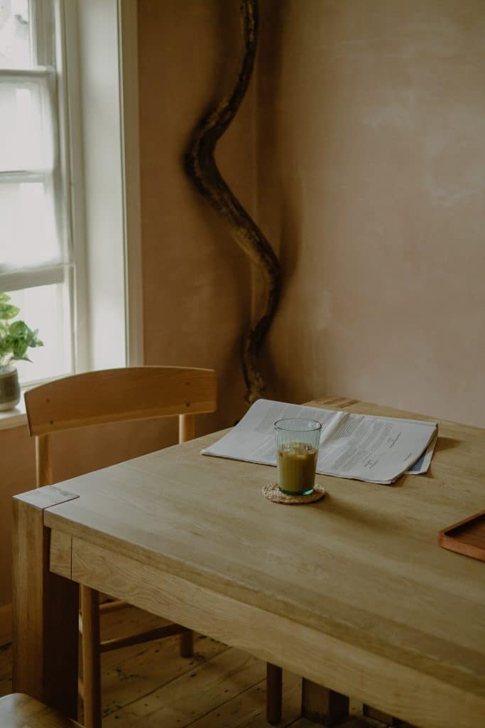 a chair sitting in front of a wooden table