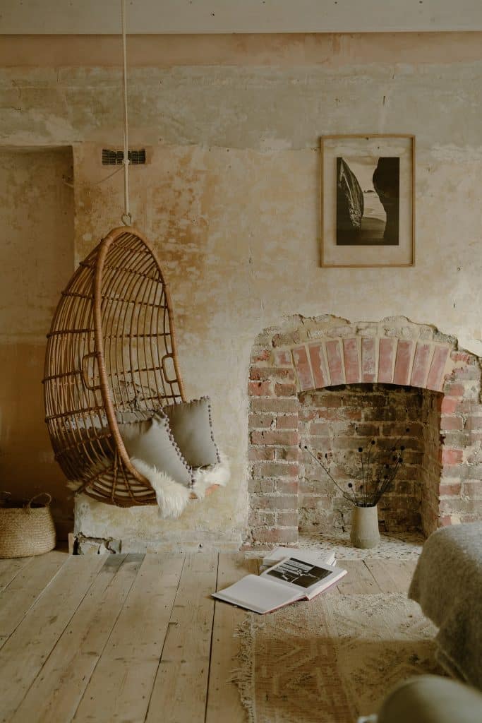 a room with a stone fireplace