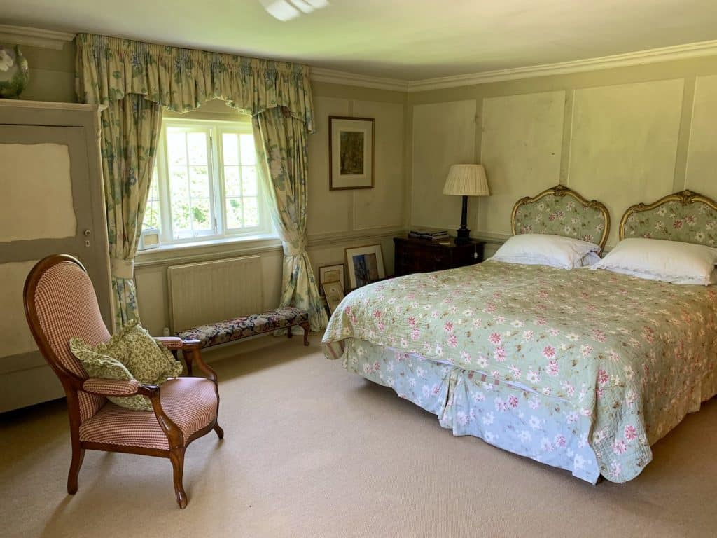 a bedroom with a bed in a room