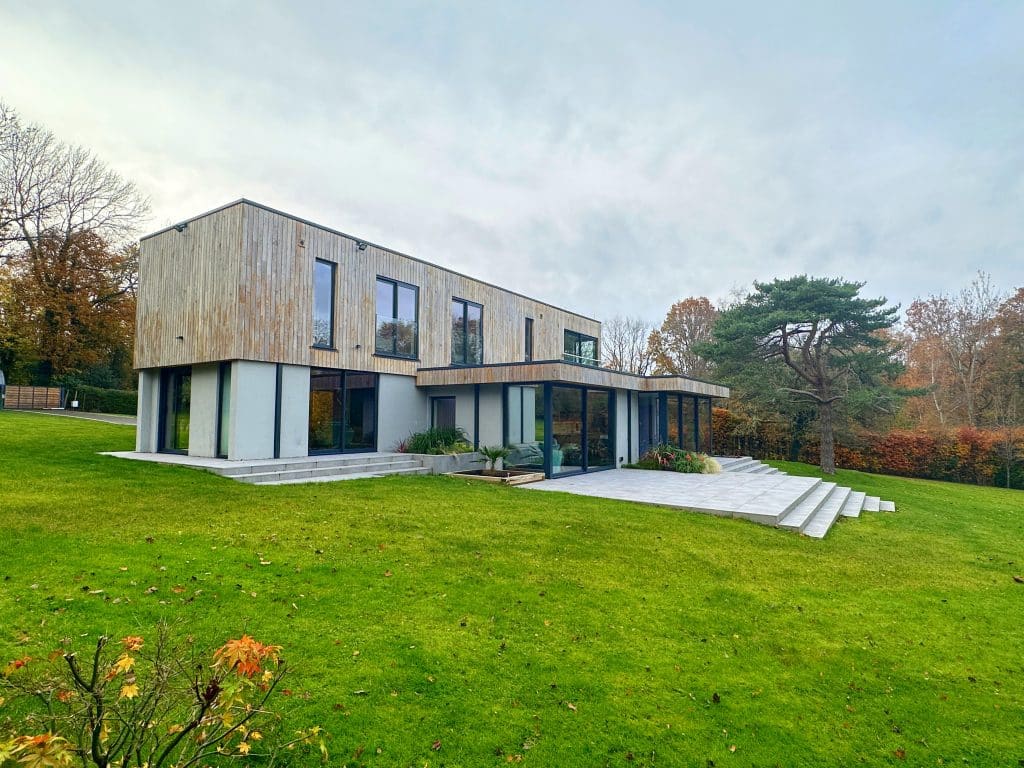 a building with a grassy field
