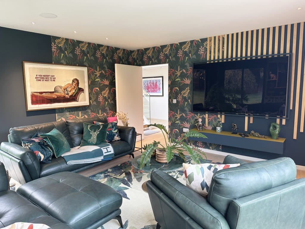 a living room filled with furniture and a flat screen tv